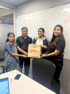 upGrad Ahmedabad office - student and parents with the counselling team after their study abroad session